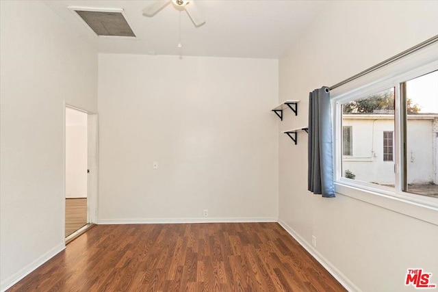 unfurnished room with ceiling fan and dark hardwood / wood-style floors