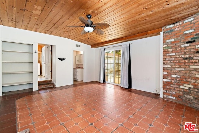 spare room featuring wood ceiling, ceiling fan, and lofted ceiling