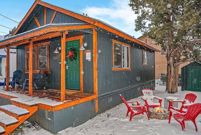 exterior space featuring an outdoor fire pit