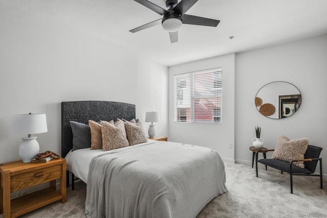 bedroom with ceiling fan and light colored carpet