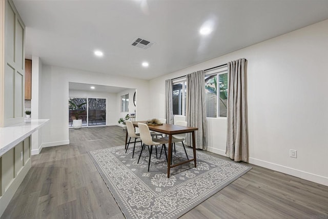 dining room with hardwood / wood-style flooring