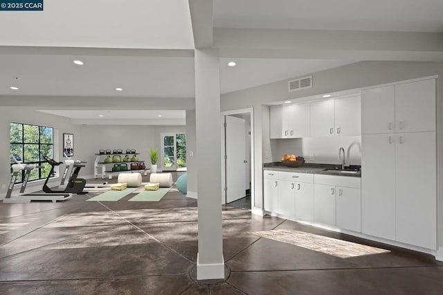 kitchen featuring sink, white cabinetry, and plenty of natural light