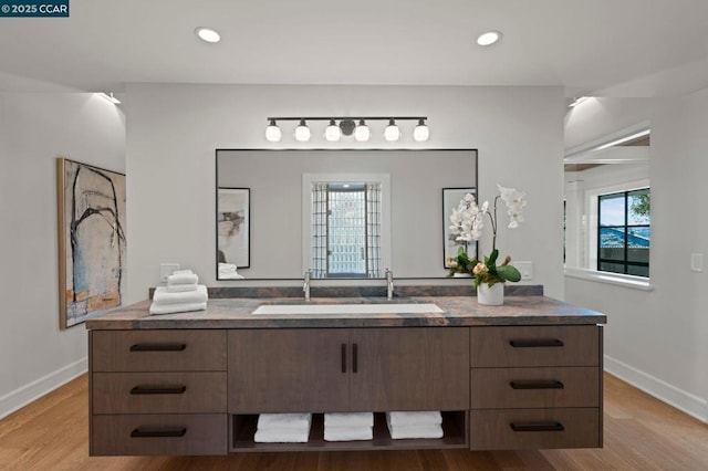 bathroom featuring vanity and hardwood / wood-style flooring