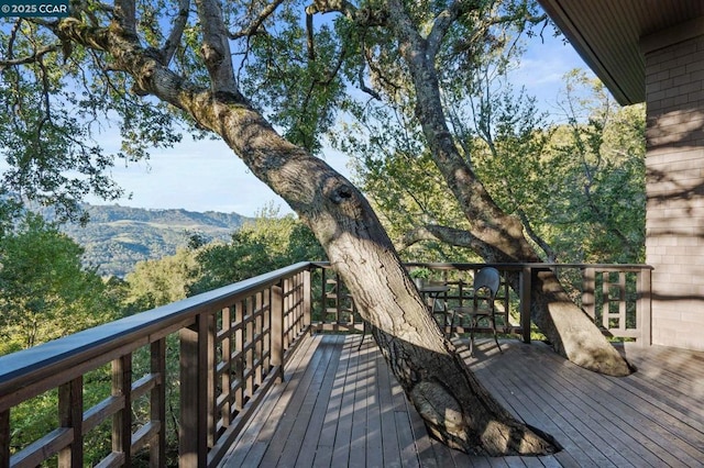 wooden terrace with a mountain view