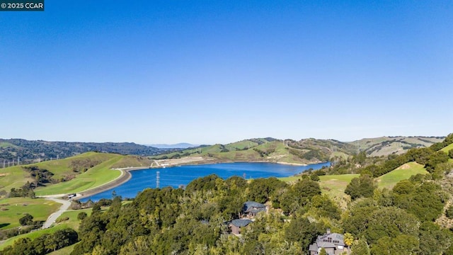 bird's eye view with a water and mountain view