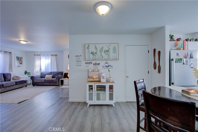 dining area with light hardwood / wood-style flooring