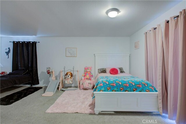 bedroom featuring light colored carpet