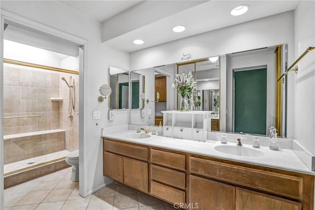 bathroom with tile patterned floors, toilet, walk in shower, and vanity