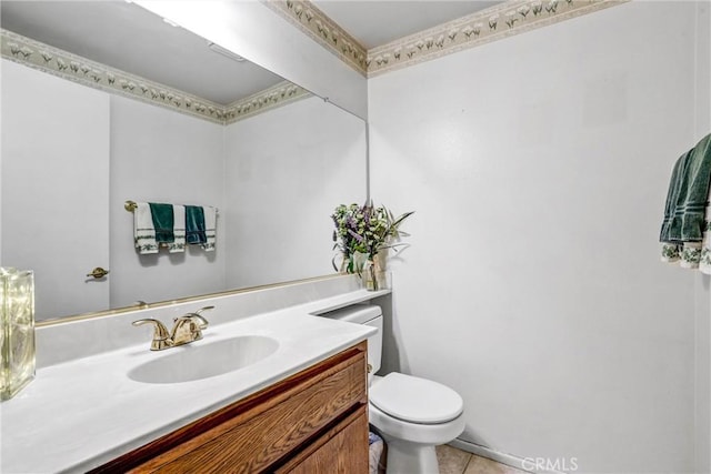 bathroom with vanity, toilet, and tile patterned floors