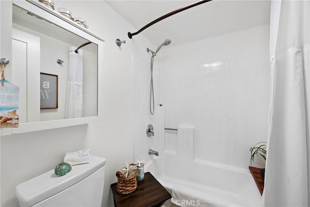 bathroom with shower / bathtub combination with curtain and toilet