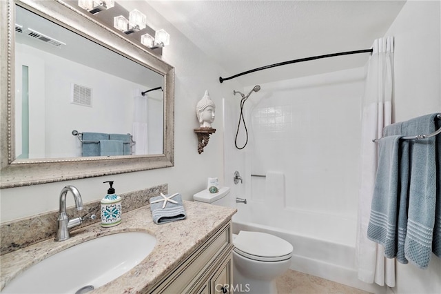 full bathroom with vanity, toilet, shower / bathtub combination with curtain, tile patterned floors, and a textured ceiling