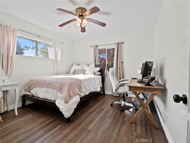 bedroom featuring ceiling fan and dark hardwood / wood-style flooring