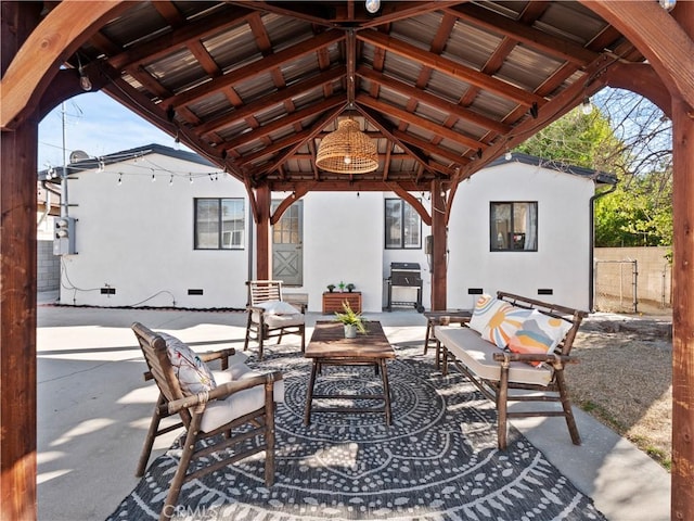 view of patio featuring a gazebo, an outdoor hangout area, and a grill