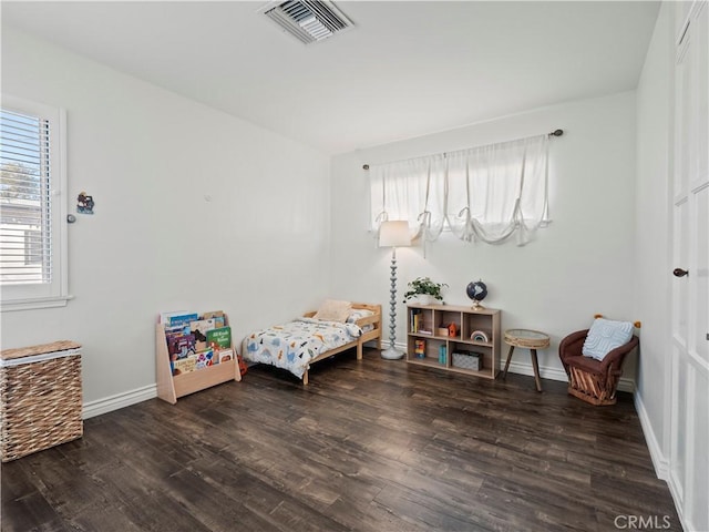 bedroom featuring dark hardwood / wood-style floors