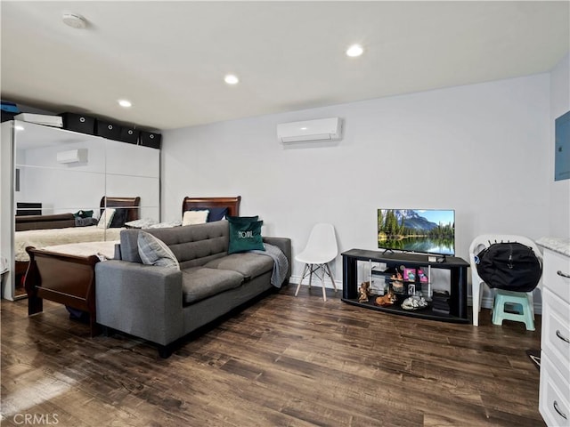 living room with an AC wall unit and dark hardwood / wood-style flooring