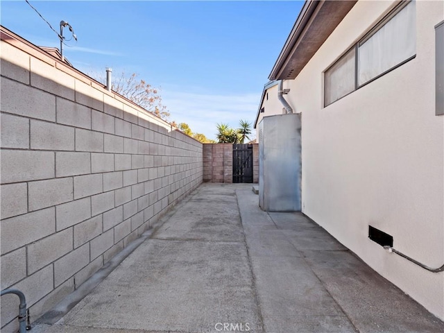 view of side of property with a patio