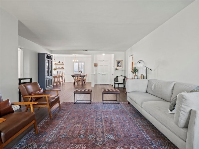 living room featuring hardwood / wood-style floors and a chandelier