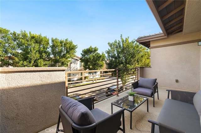 view of patio featuring a balcony