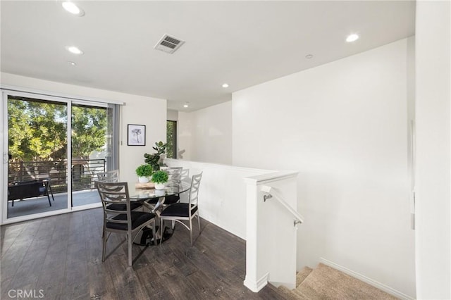 dining room with dark hardwood / wood-style flooring