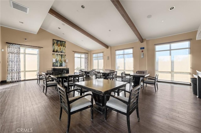 dining area with lofted ceiling with beams and dark hardwood / wood-style flooring