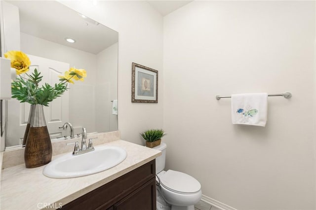 bathroom with vanity and toilet