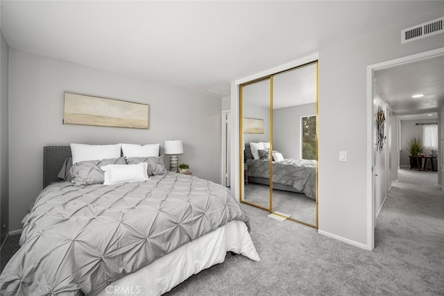 carpeted bedroom with a closet