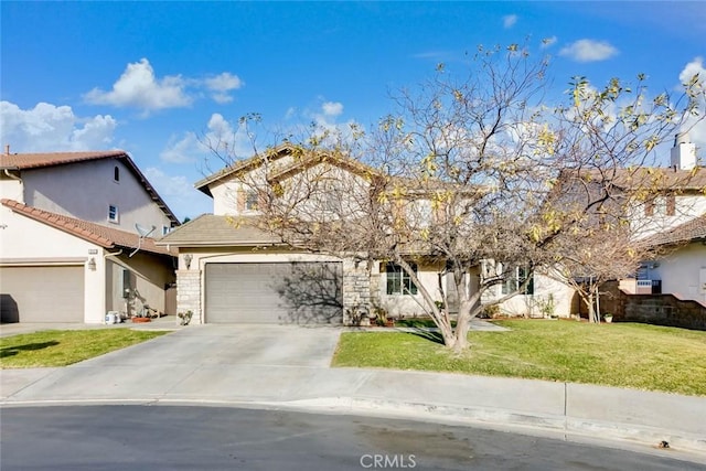 view of front of home featuring a front yard and a garage