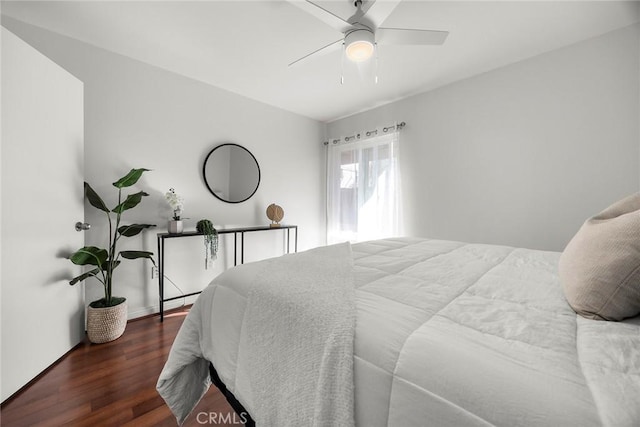 bedroom featuring dark wood-type flooring and ceiling fan