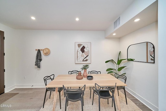 dining area featuring hardwood / wood-style floors