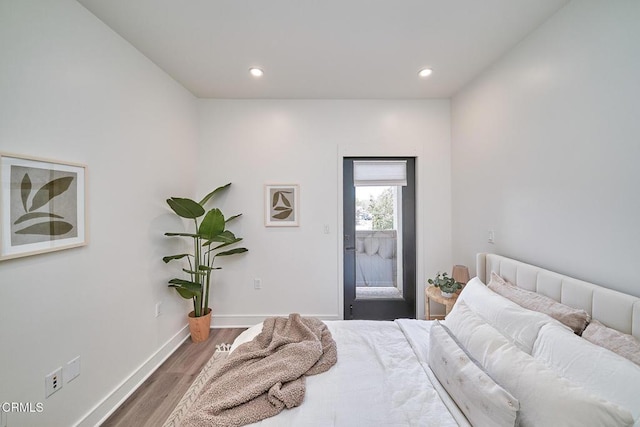 bedroom with hardwood / wood-style floors