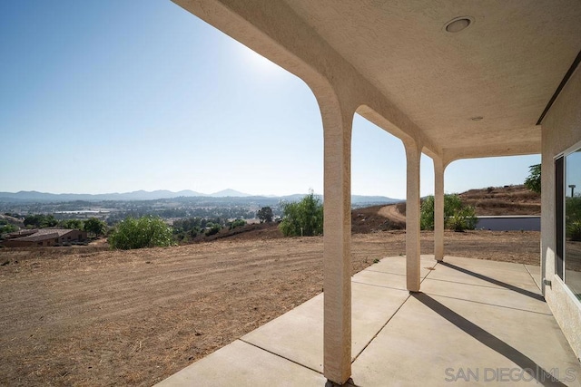 view of patio / terrace featuring a mountain view