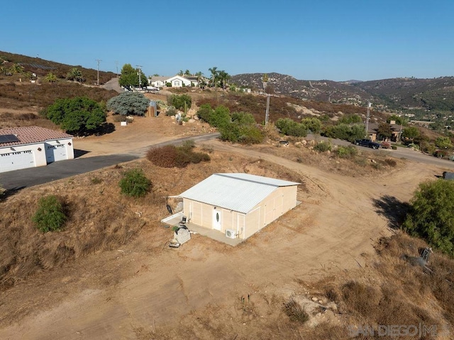 birds eye view of property with a mountain view