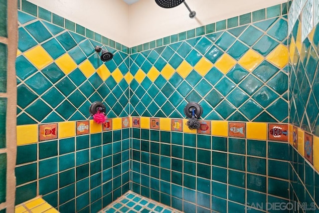 bathroom with a tile shower