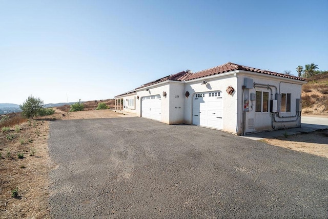 view of property exterior with a garage