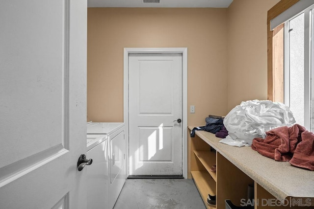 laundry room with washing machine and dryer