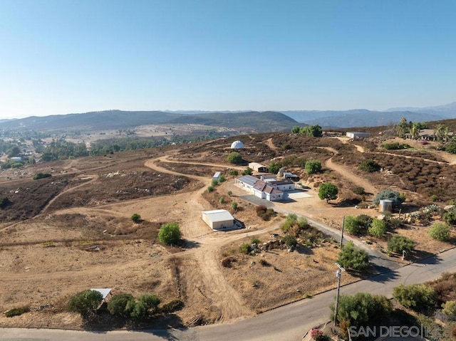 birds eye view of property featuring a mountain view