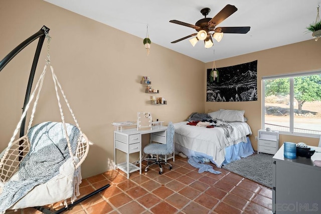 bedroom featuring ceiling fan and tile patterned flooring