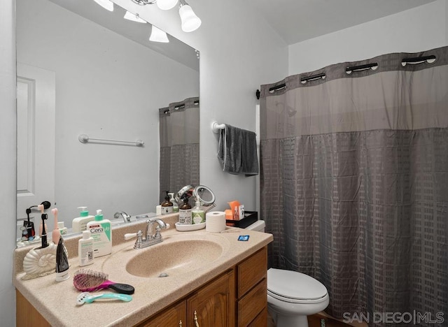 bathroom with vanity and toilet