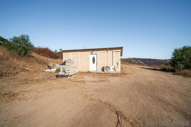 view of outbuilding with ac unit