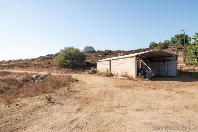 view of yard featuring a carport