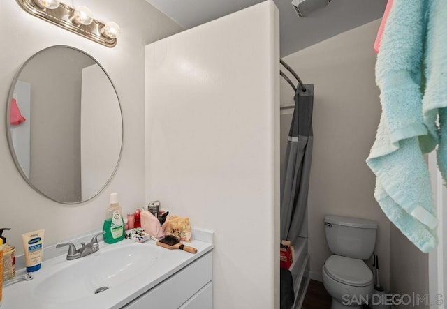 full bathroom featuring shower / bath combo, toilet, and vanity