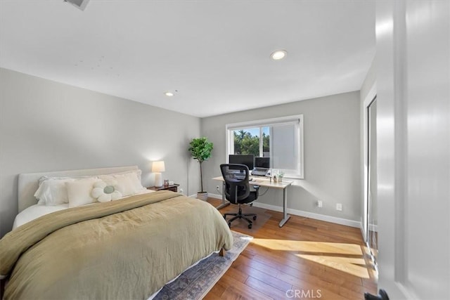 bedroom featuring wood-type flooring