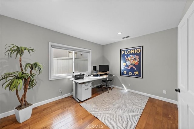 office space with light hardwood / wood-style flooring