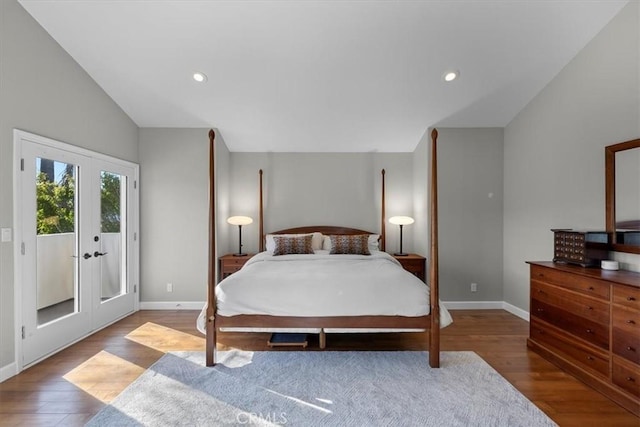 bedroom featuring hardwood / wood-style floors, french doors, lofted ceiling, and access to outside