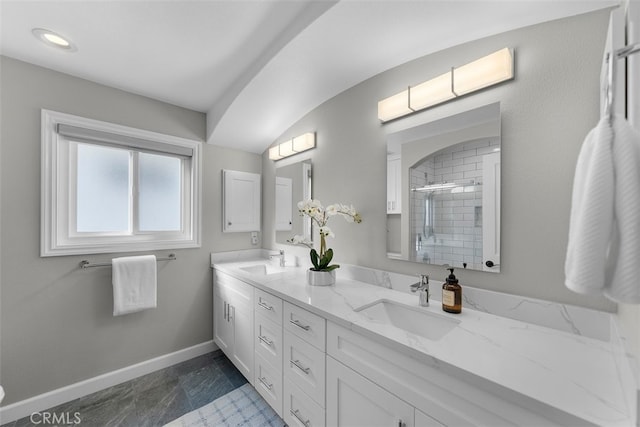 bathroom with vanity and a shower with shower door