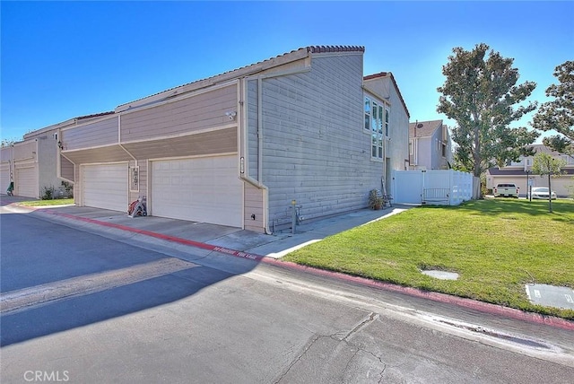 view of property exterior featuring a lawn