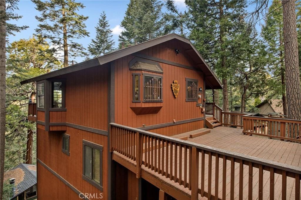 view of side of home featuring a deck