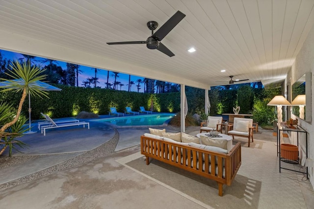 patio terrace at dusk with ceiling fan, a fenced in pool, and outdoor lounge area