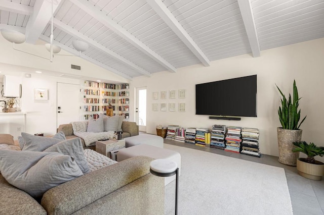 tiled living room with lofted ceiling with beams