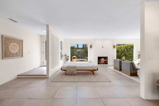 unfurnished living room with light tile patterned floors